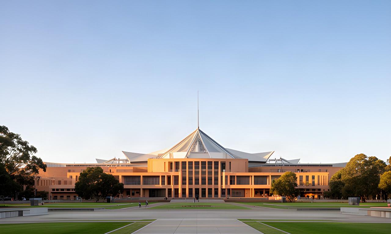 Parliament House in Canberra viewed across the forecourt on a clear morning